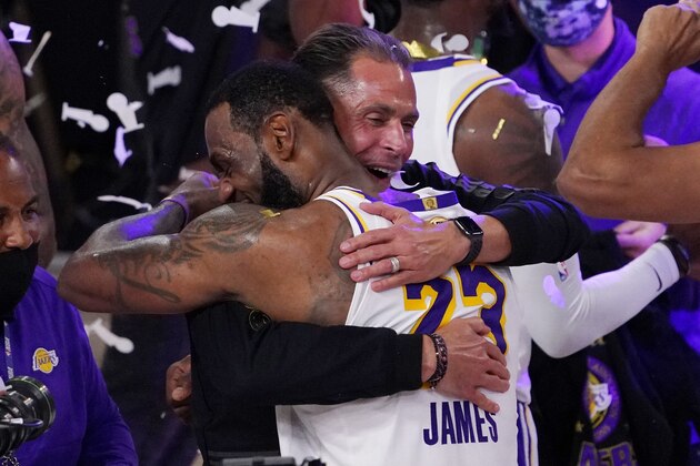 Los Angeles Lakers GM Rob Pelinka hugs LeBron James after the Lakers defeated the Miami Heat 106-93 in Game 6 of basketball's NBA Finals Sunday, Oct. 11, 2020, in Lake Buena Vista, Fla. (AP Photo/Mark J. Terrill)