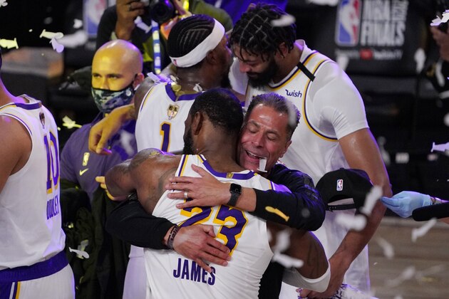 Los Angeles Lakers GM Rob Pelinka hugs LeBron James after the Lakers defeated the Miami Heat 106-93 in Game 6 of basketball's NBA Finals Sunday, Oct. 11, 2020, in Lake Buena Vista, Fla. (AP Photo/Mark J. Terrill)