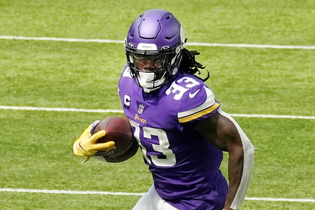 Minnesota Vikings running back Dalvin Cook (33) carries the ball during an NFL football game against the Green Bay Packers, Sunday, Sept. 13, 2020, in Minneapolis. (AP Photo/Jim Mone)