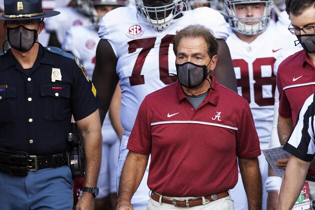 Alabama coach Nick Saban leads his team to the field before an NCAA college football game against Missouri on Saturday, Sept. 26, 2020, in Columbia, Mo. (AP Photo/L.G. Patterson)