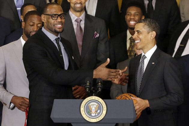 LeBron James speaks after presenting President Barack Obama with a basketball signed by the NBA champions Miami Heat basketball team in the East Room at the White House in Washington, Monday, Jan. 28, 2013. (AP Photo/Charles Dharapak)