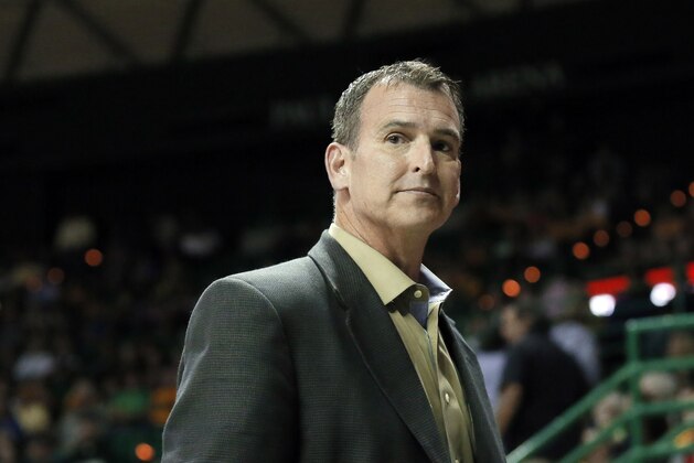 Baylor athletic director Mack Rhoades takes in play during a women's NCAA college basketball game against UCLA on Monday Nov. 14, 2016, in Waco, Texas. (AP Photo/Tony Gutierrez)