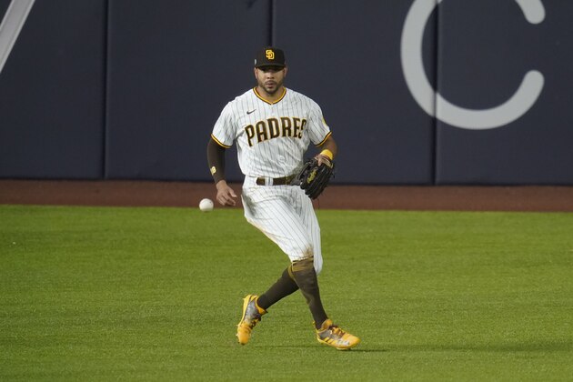 San Diego Padres left fielder Tommy Pham chases down a ball in Game 3 of a baseball National League Division Series against the Los Angeles Dodgers Thursday, Oct. 8, 2020, in Arlington, Texas. (AP Photo/Sue Ogrocki)