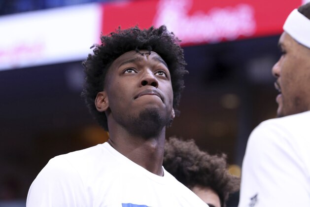 FILE - In this Dec. 3, 2019, file photo, Memphis' James Wiseman pauses during a timeout in the second half of an NCAA college basketball game against Bradley in Memphis, Tenn. Wiseman is expected to be a contender for the No. 1 draft pick in the NBA draft lottery Thursday, Aug. 20, 2020. (AP Photo/Karen Pulfer Focht, File)
