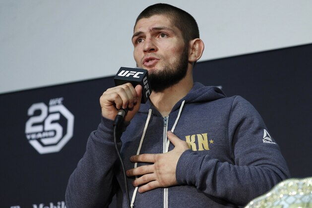 FILE - In this Saturday, Oct. 6, 2018 file photo Khabib Nurmagomedov speaks at a news conference after the UFC 229 mixed martial arts event in Las Vegas. UFC champion Khabib Nurmagomedov is probably the best-known Muslim athlete in Russia, and he's rapidly becoming a leading conservative voice at home. When a National Guardsman was killed while apparently trying to break up a fight outside an establishment variously described as a cafe and nightclub early Sunday morning, Nurmagomedov called for a crackdown on the local nightlife in his mostly-Muslim home region of Dagestan.(AP Photo/John Locher, File)
