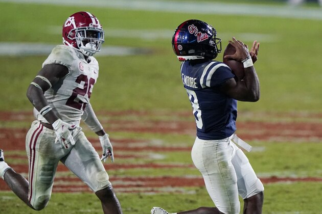 Mississippi wide receiver Elijah Moore (8) catches a pass in front of Alabama defensive back DeMarcco Hellams (29) during the second half of an NCAA college football game in Oxford, Miss., Saturday, Oct. 10, 2020. Alabama won 63-48. (AP Photo/Rogelio V. Solis)