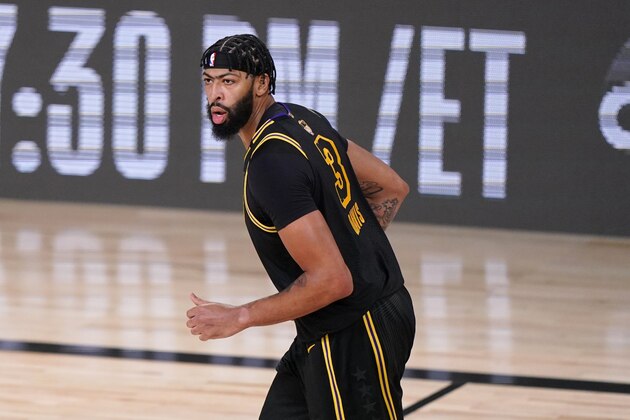 Los Angeles Lakers' Anthony Davis (3) runs down court during the second half of Game 2 of basketball's NBA Finals against the Miami Heat on Friday, Oct. 2, 2020, in Lake Buena Vista, Fla. (AP Photo/Mark J. Terrill)