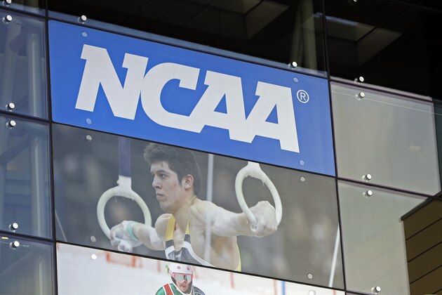 FILE - In this April 25, 2018, file photo, the NCAA headquarters is shown in Indianapolis. More than a dozen national associations in various sports – hockey, soccer, tennis, golf, swimming and gymnastics, among them – have signed a memo outlining “significant concerns” about effects of allowing athletes to profit for use of their names, images and likenesses (NIL). (AP Photo/Darron Cummings, File)