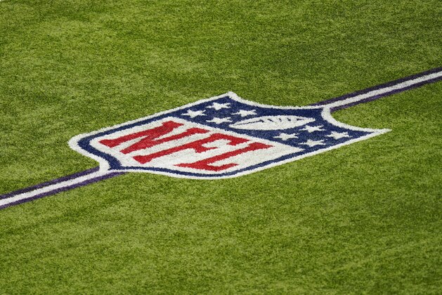 The NFL logo is seen on the field in U.S. Bank Stadium before an NFL football game between the Minnesota Vikings and the Tennessee Titans, Sunday, Sept. 27, 2020, in Minneapolis. (AP Photo/Charlie Neibergall)