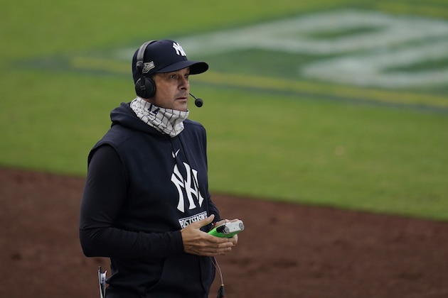 New York Yankees manager Aaron Boone takes part in a TV interview during a pause in Game 4 of a baseball American League Division Series against the Tampa Bay Rays, Thursday, Oct. 8, 2020, in San Diego. (AP Photo/Gregory Bull)