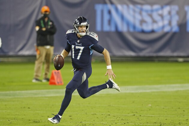 Tennessee Titans quarterback Ryan Tannehill (17) scrambles against the Buffalo Bills in the second half of an NFL football game Tuesday, Oct. 13, 2020, in Nashville, Tenn. (AP Photo/Wade Payne)