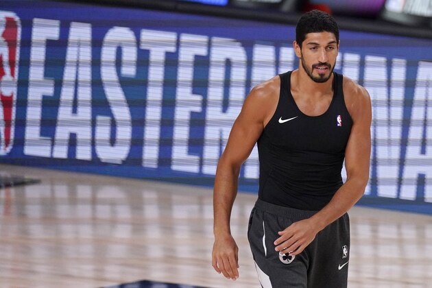 Boston Celtics center Enes Kanter (11) warms up before Game 4 of an NBA basketball Eastern Conference final against the Miami Heat on Wednesday, Sept. 23, 2020, in Lake Buena Vista, Fla. (AP Photo/Mark J. Terrill)
