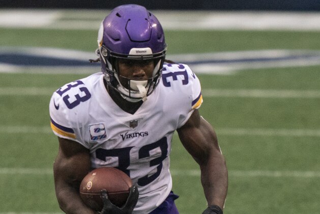 Minnesota Vikings running back Dalvin Cook runs with the ball during the first half an NFL football game against the Seattle Seahawks, Sunday, Oct. 11, 2020, in Seattle. The Seahawks won 27-26. (AP Photo/Stephen Brashear)
