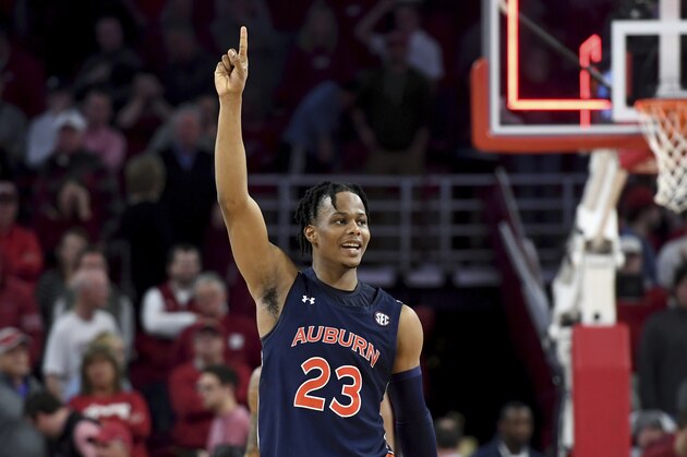 Auburn's Isaac Okoro (23) celebrates after Auburn defeated Arkansas 79-76 in overtime in an NCAA college basketball game Tuesday, Feb. 4, 2020, in Fayetteville, Ark. (AP Photo/Michael Woods)