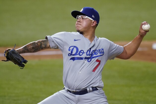 Los Angeles Dodgers' Julio Urias delivers to the San Diego Padres during the second inning in Game 3 of a baseball National League Division Series Thursday, Oct. 8, 2020, in Arlington, Texas. (AP Photo/Sue Ogrocki)
