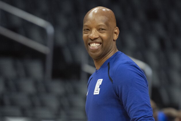 Los Angeles Clippers assistant coach Sam Cassell watches his players warm up before an NBA basketball game against the Denver Nuggets in Los Angeles Saturday, Dec. 22, 2018. (AP Photo/Kyusung Gong)