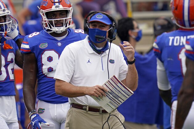 Florida head coach Dan Mullen directs his players against South Carolina during the first half of an NCAA college football game, Saturday, Oct. 3, 2020, in Gainesville, Fla. (AP Photo/John Raoux)