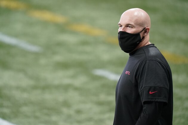 Atlanta Falcons head coach Dan Quinn walks the turf before the first half of an NFL football game between the Atlanta Falcons and the Carolina Panthers, Sunday, Oct. 11, 2020, in Atlanta. (AP Photo/Brynn Anderson)