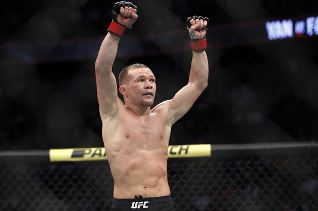 Petr Yan celebrates after defeating Urijah Faber in a mixed martial arts bantamweight bout at UFC 245, Saturday, Dec. 14, 2019, in Las Vegas. (AP Photo/John Locher)