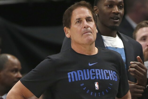 Dallas Mavericks owner Mark Cuban looks on as the Mavericks play the Denver Nuggets during the second half of an NBA basketball game, Wednesday, March 11, 2020, in Dallas. The Mavericks won 113-97. (AP Photo/Ron Jenkins)