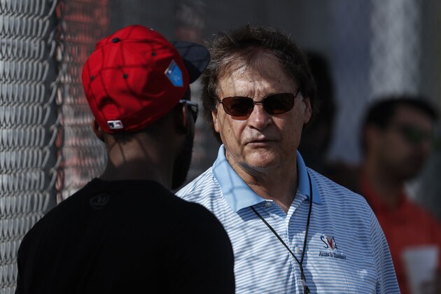 Boston Red Sox special assistant Tony La Russa speaks with a player during baseball spring training, Tuesday, Feb. 13, 2018, in Fort Myers, Fla. (AP Photo/John Minchillo)