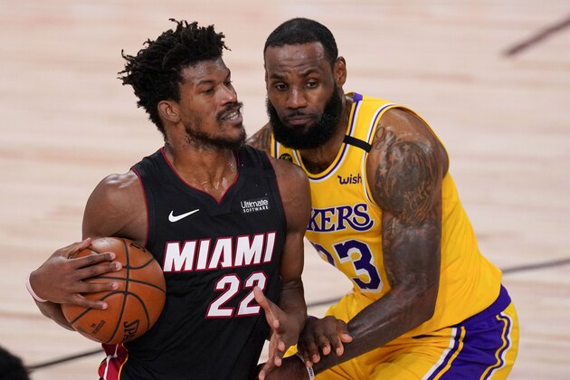 Miami Heat forward Jimmy Butler drives around Los Angeles Lakers forward LeBron James during the second half in Game 4 of basketball's NBA Finals Tuesday, Oct. 6, 2020, in Lake Buena Vista, Fla. (AP Photo/Mark J. Terrill) Miami Heat forward Jimmy Butler drives around Los Angeles Lakers forward LeBron James during the second half in Game 4 of basketball's NBA Finals Tuesday, Oct. 6, 2020, in Lake Buena Vista, Fla. (AP Photo/Mark J. Terrill)