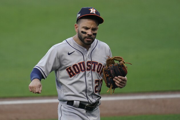 Houston Astros second baseman Jose Altuve walks to the dugout after the third inning in Game 1 of a baseball American League Championship against the Tampa Bay Rays, Sunday, Oct. 11, 2020, in San Diego. Altuve hit a single home run in the first inning. (AP Photo/Gregory Bull)