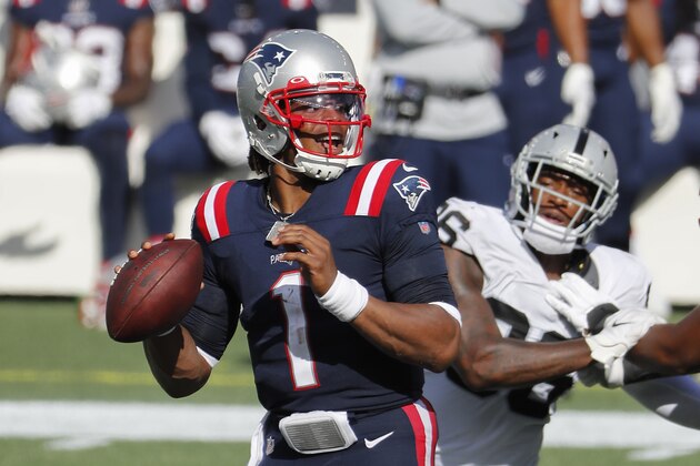 New England Patriots quarterback Cam Newton looks to pass against the Las Vegas Raiders during an NFL football game at Gillette Stadium, Sunday, Sept. 27, 2020 in Foxborough, Mass. (Winslow Townson/AP Images for Panini) New England Patriots quarterback Cam Newton looks to pass against the Las Vegas Raiders during an NFL football game at Gillette Stadium, Sunday, Sept. 27, 2020 in Foxborough, Mass. (Winslow Townson/AP Images for Panini)