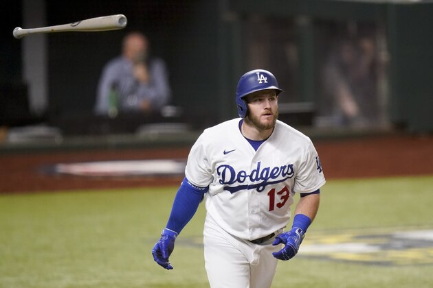Los Angeles Dodgers' Max Muncy hits a two-run home run against the Atlanta Braves during the ninth inning in Game 2 of a baseball National League Championship Series Tuesday, Oct. 13, 2020, in Arlington, Texas. (AP Photo/Eric Gay)