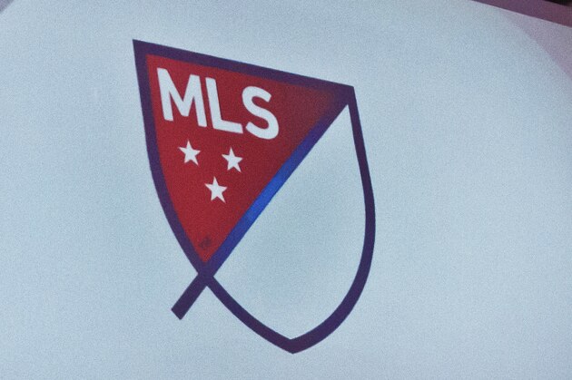 Major League Soccer's new logo is projected during a press conference on Thursday, Sept. 18, 2014, in New York.  (AP Photo/Bebeto Matthews)