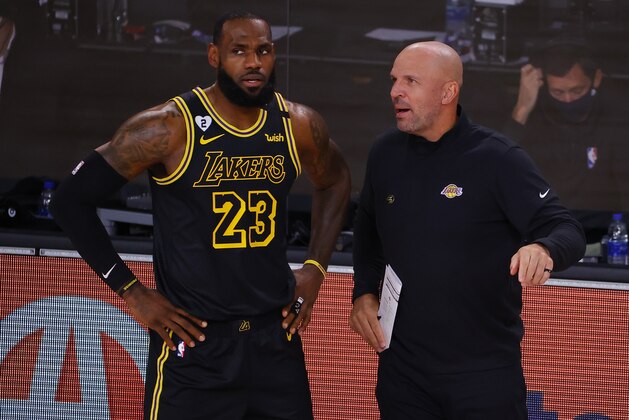 Los Angeles Lakers' LeBron James (23) talks with Jason Kidd in Game 4 of an NBA basketball first-round playoff series against the Portland Trail Blazers, Monday, Aug. 24, 2020, in Lake Buena Vista, Fla. (Kevin C. Cox/Pool Photo via AP)