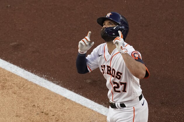 Houston Astros' Jose Altuve celebrates after hitting a solo home run against Tampa Bay Rays pitcher Tyler Glasnow during the first inning in Game 4 of a baseball American League Championship Series, Wednesday, Oct. 14, 2020, in San Diego. (AP Photo/Ashley Landis)
