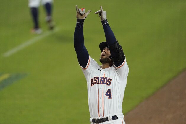 Houston Astros George Springer celebrates after hitting a two run home run against the Tampa Bay Rays during the fifth inning in Game 4 of a baseball American League Championship Series, Wednesday, Oct. 14, 2020, in San Diego. (AP Photo/Ashley Landis)