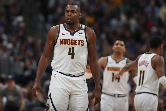 Denver Nuggets forward Paul Millsap (4) in the second half of an NBA basketball game Monday, March 9, 2020, in Denver. The Nuggets won 109-95. (AP Photo/David Zalubowski)