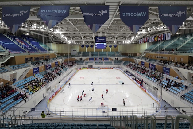 FILE - In this April 4, 2017, file photo, fans an under-17 World Championship Division II Group A hockey game game between Croatia and Estonia at Kwandong Hockey Center in Gangneung, South Korea. Olympic hockey played on wider international-sized ice changes everything about the style of play and is much different than the NHL. The United States and Canada in the past have needed to adjust to the bigger rinks, though most players going to South Korea are currently playing on it. (AP Photo/Ahn Young-joon, File)