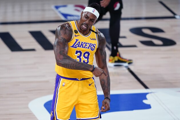Los Angeles Lakers center Dwight Howard (39) reacts after a slam dunk during the first half of an NBA basketball game against the Portland Trail Blazers Tuesday, Aug. 18, 2020, in Lake Buena Vista, Fla. (AP Photo/Ashley Landis, Pool)