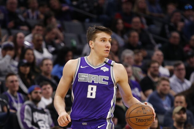 Sacramento Kings guard Bogdan Bogdanovic dribbles down court during the second half of an NBA basketball game against the Toronto Raptors in Sacramento, Calif., Sunday, March 8, 2020. The Raptors won 118-113. (AP Photo/Rich Pedroncelli)