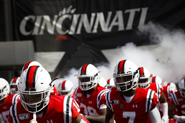 The Cincinnati Bearcats take the field before an NCAA college football game against Miami of Ohio, Saturday, Sept. 14, 2019, in Cincinnati. (AP Photo/John Minchillo)