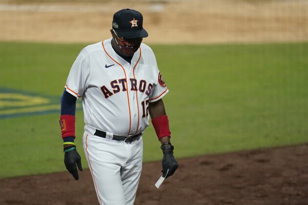 Houston Astros manager Dusty Baker Jr. walks back to the dugout after relieving Houston Astros' Enoli Paredes during the sixth inning in Game 3 of a baseball American League Championship Series, Tuesday, Oct. 13, 2020, in San Diego. (AP Photo/Gregory Bull)