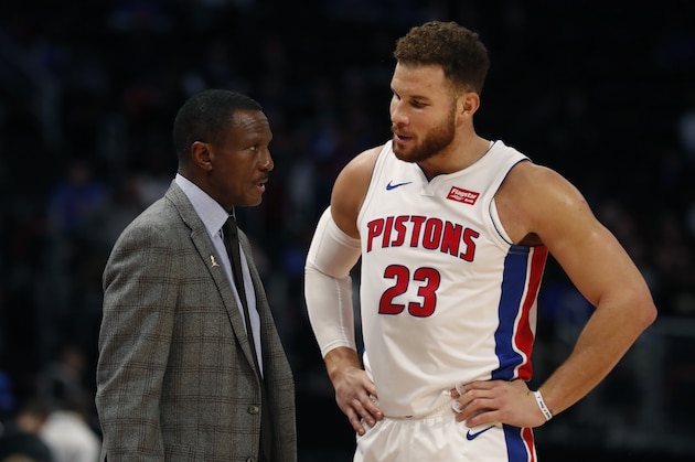 Detroit Pistons head coach Dwane Casey talks to forward Blake Griffin (23) during the second half of an NBA basketball game, Monday, Nov. 19, 2018, in Detroit. (AP Photo/Carlos Osorio)