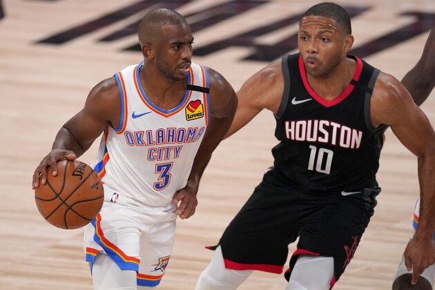 Oklahoma City Thunder's Chris Paul (3) works against Houston Rockets' Eric Gordon (10) as he advances the ball up court during the first half of an NBA first-round playoff basketball game in Lake Buena Vista, Fla., Wednesday, Sept. 2, 2020. (AP Photo/Mark J. Terrill)