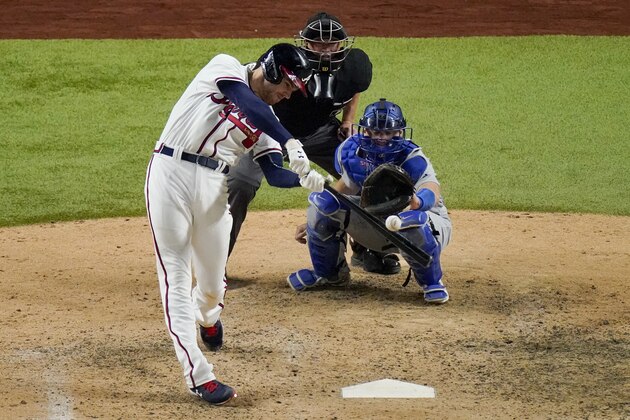 Atlanta Braves' Freddie Freeman his a RBI-single against the Los Angeles Dodgers during the eighth inning in Game 4 of a baseball National League Championship Series Thursday, Oct. 15, 2020, in Arlington, Texas. (AP Photo/Sue Ogrocki)