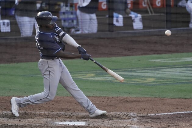 Tampa Bay Rays Randy Arozarena hits a solo home run against Houston Astros' Enoli Paredes during the fifth inning in Game 5 of a baseball American League Championship Series, Thursday, Oct. 15, 2020, in San Diego.(AP Photo/Ashley Landis)