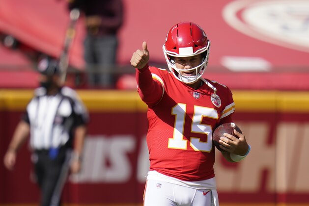 Kansas City Chiefs quarterback Patrick Mahomes warms up before an NFL football game against the Las Vegas Raiders, Sunday, Oct. 11, 2020, in Kansas City. (AP Photo/Jeff Roberson)