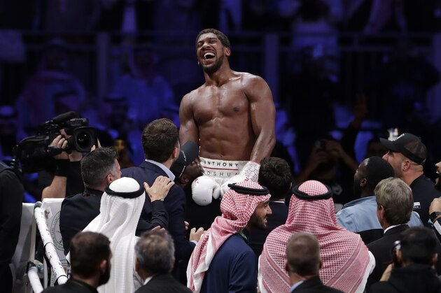 Britain's Anthony Joshua celebrates after beating Andy Ruiz Jr. to win their World Heavyweight Championship contest at the Diriyah Arena, Riyadh, Saudi Arabia. (AP Photo/Hassan Ammar) Britain's Anthony Joshua celebrates after beating Andy Ruiz Jr. to win their World Heavyweight Championship contest at the Diriyah Arena, Riyadh, Saudi Arabia. (AP Photo/Hassan Ammar)