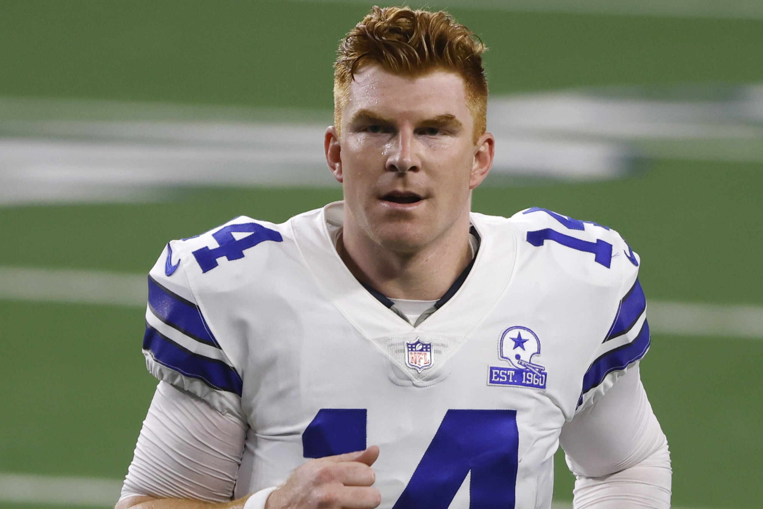 Dallas Cowboys quarterback Andy Dalton (14) jogs off the field after their 37-34 win against the New York Giants in an NFL football game in Arlington, Texas, Sunday, Oct. 11, 2020. (AP Photo/Ron Jenkins)