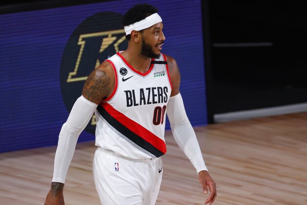 Portland Trail Blazers' Carmelo Anthony reacts after being charged with an offensive foul against the Los Angeles Lakers in Game 4 of an NBA basketball first-round playoff series, Monday, Aug. 24, 2020, in Lake Buena Vista, Fla. (Kevin C. Cox/Pool Photo via AP)