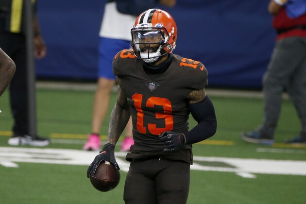 Cleveland Browns wide receiver Odell Beckham Jr. (13), runs off the field after making a touchdown pass against the Dallas Cowboys during the first half of an NFL football game in Arlington, Texas, Sunday, Oct. 4, 2020. (AP Photo/Michael Ainsworth)