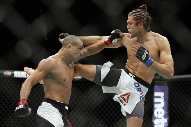 FILE - In this Jan. 2, 2016, file photo, Brian Ortega, right, fights Diego Brandao during a featherweight mixed martial arts bout at UFC 195 in Las Vegas. Ortega faces Frankie Edgar at UFC 222 on Saturday night in a fight to determine the top contender for the UFC featherweight title. Ortega is risking his unbeaten record on short notice in the biggest fight of his burgeoning MMA career. (AP Photo/John Locher, File)