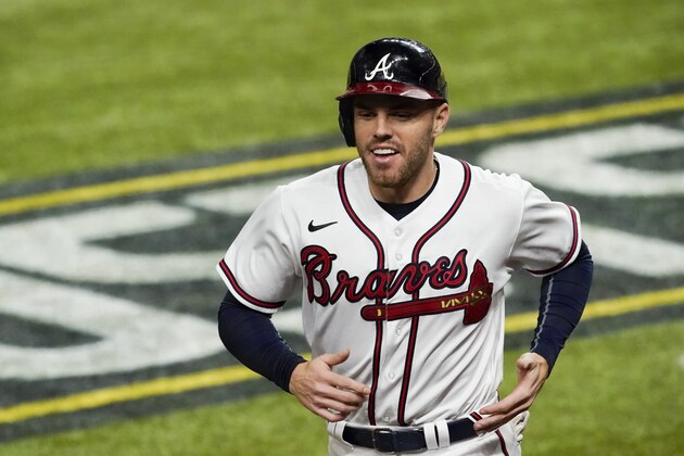 Atlanta Braves' Freddie Freeman smiles after scoring on a hit by Marcell Ozuna against the Los Angeles Dodgers during the sixth inning in Game 4 of a baseball National League Championship Series Thursday, Oct. 15, 2020, in Arlington, Texas. (AP Photo/Tony Gutierrez) Atlanta Braves' Freddie Freeman smiles after scoring on a hit by Marcell Ozuna against the Los Angeles Dodgers during the sixth inning in Game 4 of a baseball National League Championship Series Thursday, Oct. 15, 2020, in Arlington, Texas. (AP Photo/Tony Gutierrez)
